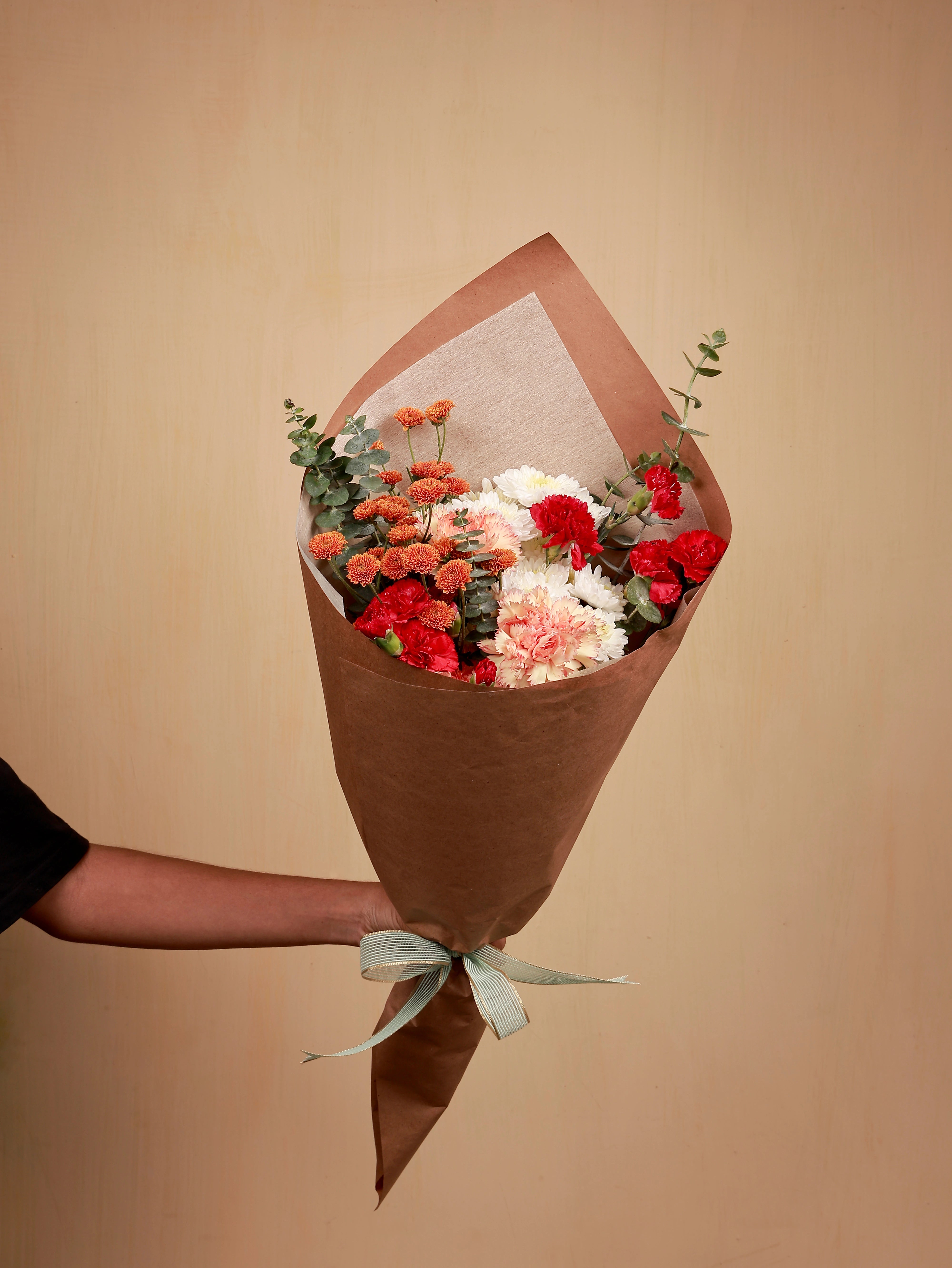 Red spray carnation with orange calimero and white chrysanthemum bouquet
